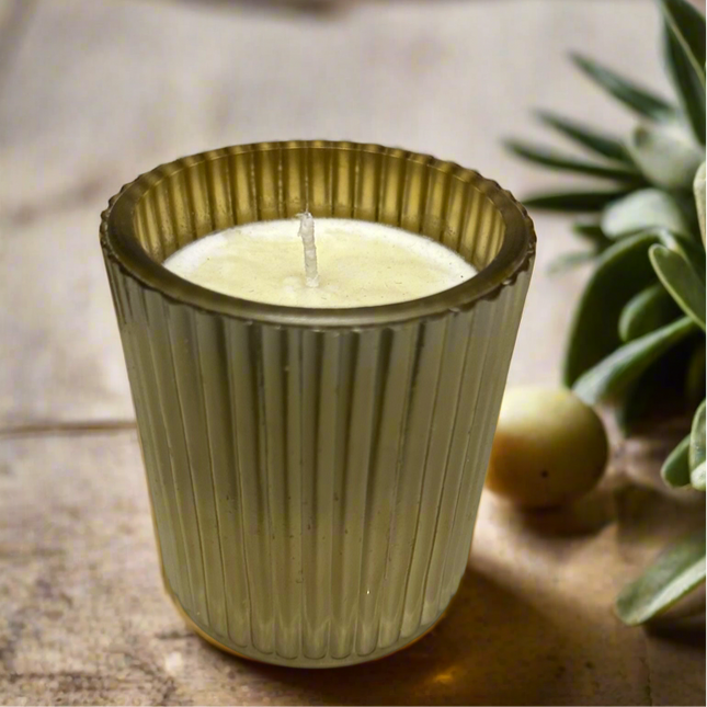 Scented candle in a lined cup